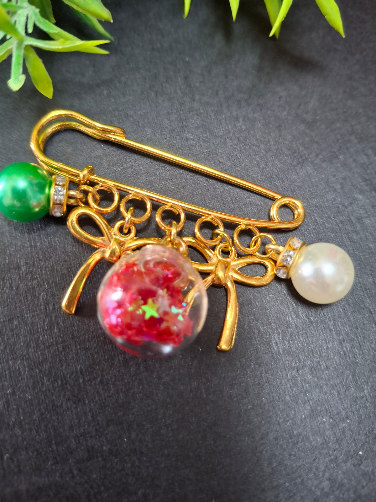 Baubles & bows safety pin binder decor